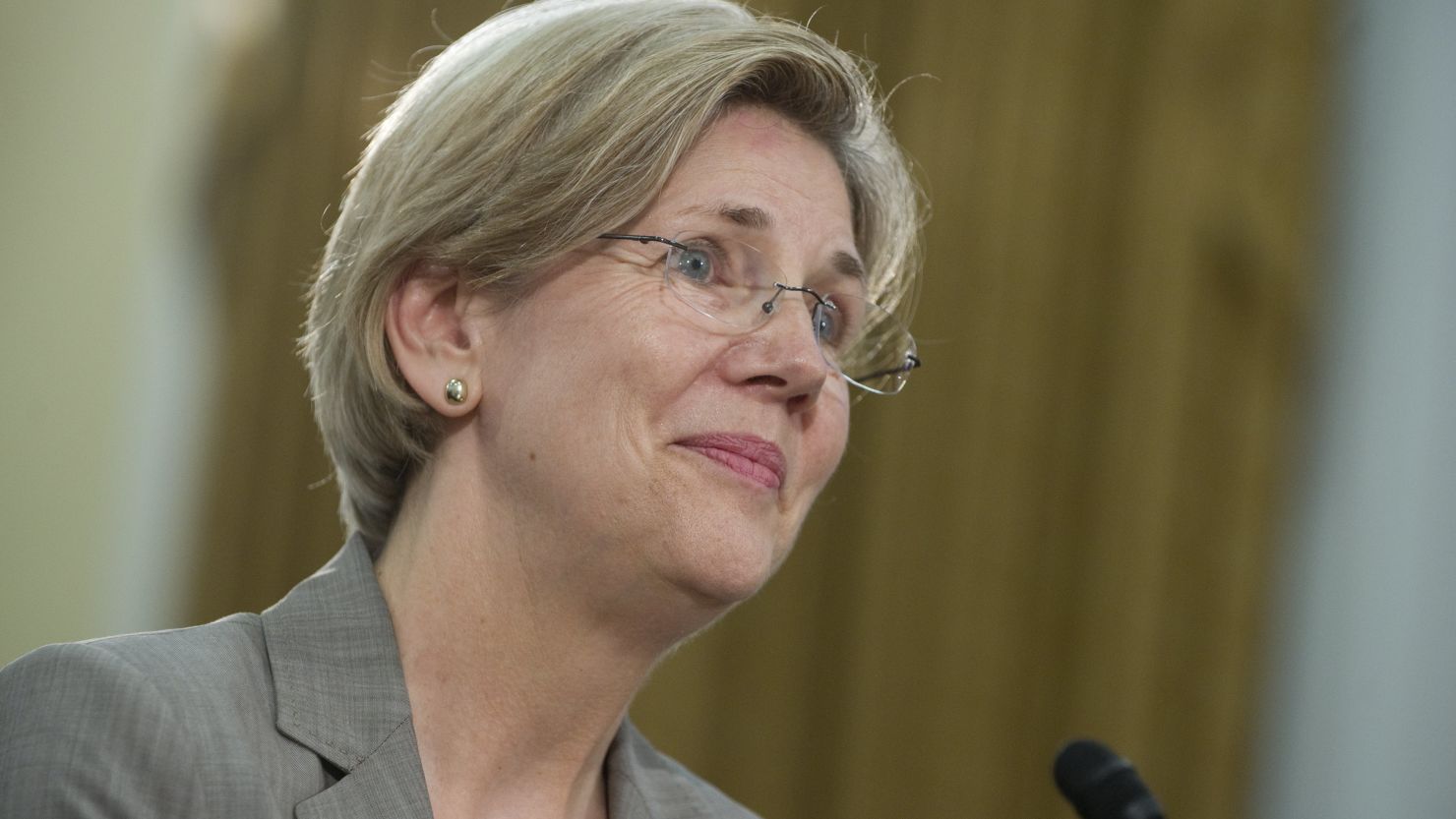 Elizabeth Warren, running against Massachusetts Sen. Scott Brown, is campaigning on the theme of aiding the middle class.
