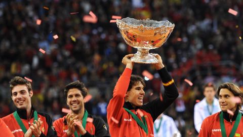 Rafael Nadal holds aloft the Davis Cup trophy after his victory gave Spain the winning point.