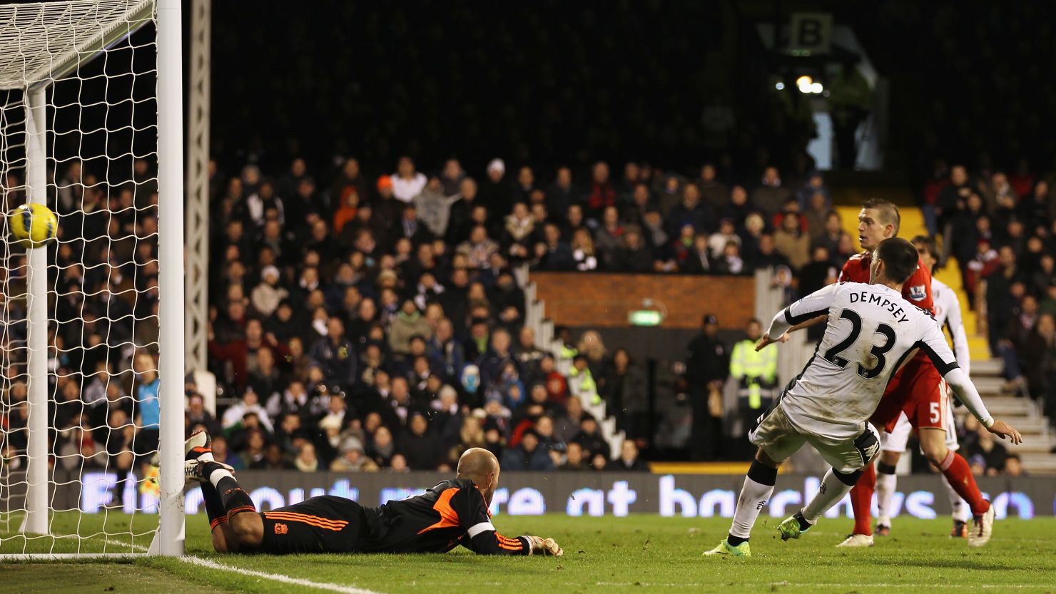 Clint Dempsey (No.23) fires home Fulham's goal in the 1-0 victory over Liverpool on Monday.
