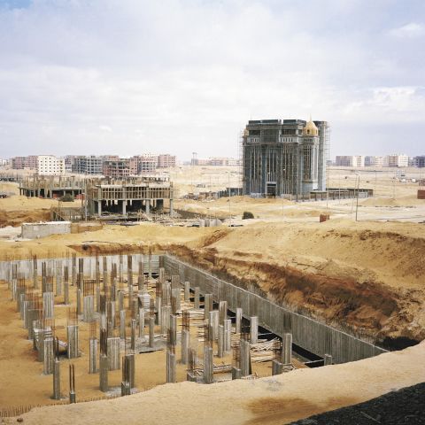 The foundations of a new office building take shape in New Cairo's business district.