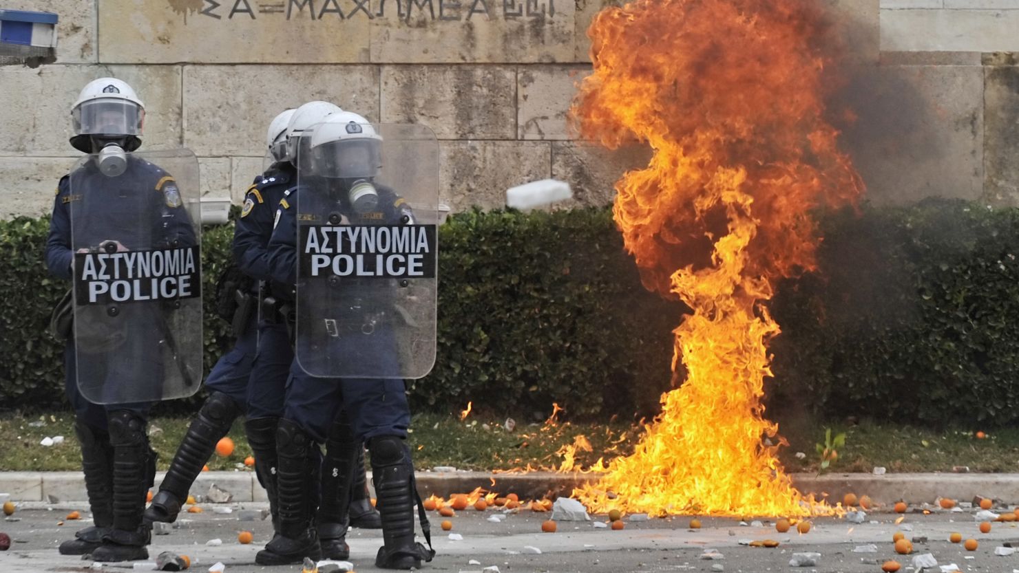 Greek police come under fire during an Athens protest marking the police killing of a teenage student hree years ago.