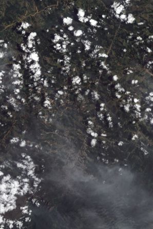 The tiny streaks of brown in this NASA image are in many instances giant <a href="index.php?page=&url=http%3A%2F%2Fedition.cnn.com%2F2011%2FWORLD%2Famericas%2F01%2F18%2Fbrazil.flooding%2Findex.html">landslides</a> which resulted from flash floods in mountainous terrain 60 kilometers north of Rio de Janeiro in January. They caused at least 900 deaths making it one of the worst natural disasters in Brazil's history, according to the World Meteorological Organization (WMO). 