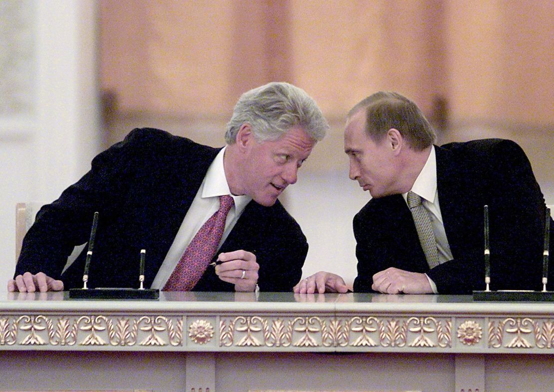 US President Bill Clinton and Russian President Vladimir Putin talk after signing a memorandum at the Kremlin on June 4, 2000, in Moscow.