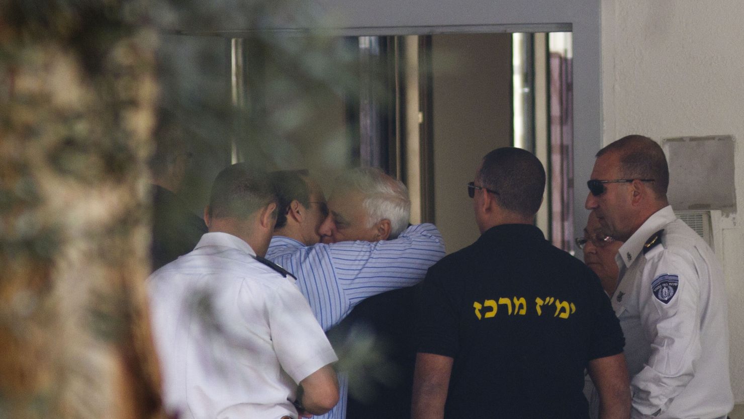 Former Israeli President Moshe Katsav hugs his son before starting a 7 year prison sentence for rape and sexual offenses.