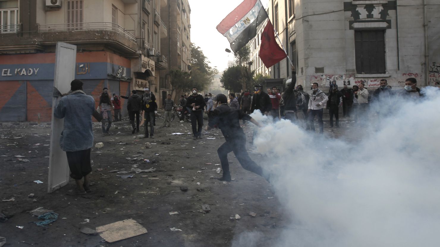 An Egyptian protester runs from tear gas during clashes with riot police in Cairo on November 23.