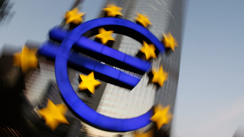 FRANKFURT AM MAIN, GERMANY - SEPTEMBER 27: (EDITORS NOTE: This image has been altered: camera was rotated during long time exposure.) The symbol of the European common currency, the Euro, stands past the headquarters of the European Central Bank (ECB) on September 27, 2011 in Frankfurt am Main, Germany. Europe is continuing to wrestle with the ominous prospect of a Greek debt default that many fear could spread panic and push the already fragile economies of Italy, Portugal and Spain into a crisis that would rock the Eurozone and lead to global repercussions. On Thursday the Bundestag, under the urging of German Chancellor Angela Merkel, is expected to pass an increase in funding for the European Financial Stability Facility (EFSF), a measure many see as necessary for financial markets to regain confidence in the European banking system. (Photo by Ralph Orlowski/Getty Images)