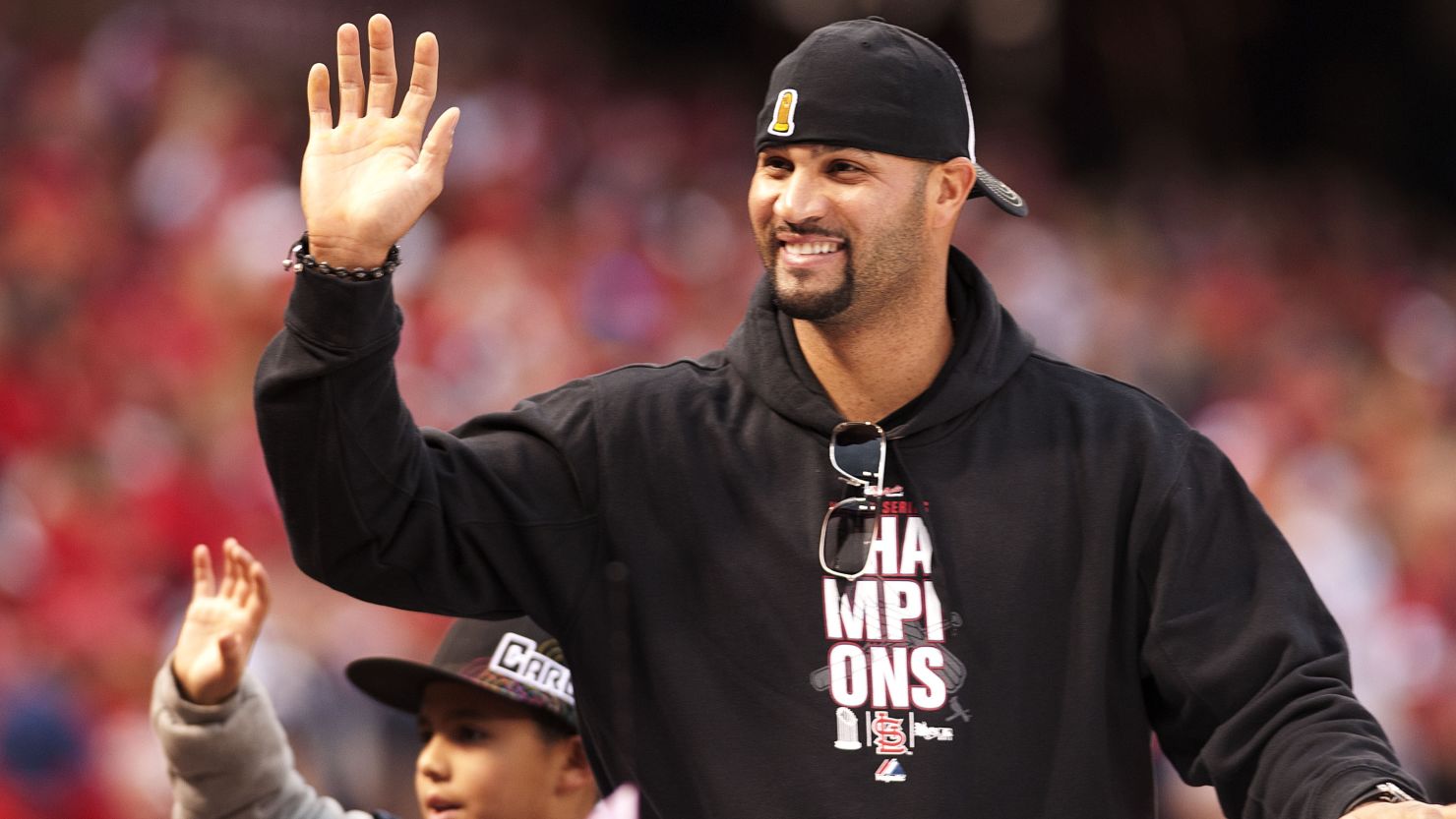 Albert Pujols of the St. Louis Cardinals joins in the World Series victory parade in October.
