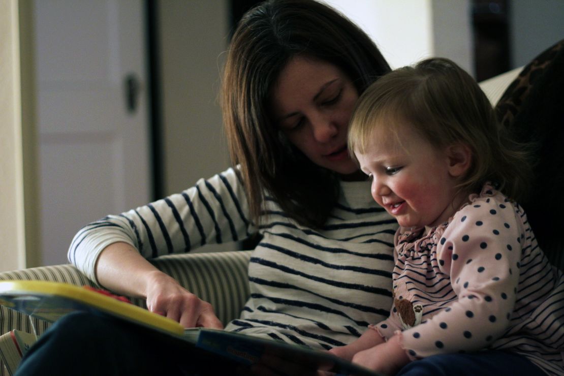 Rosenblatt's wife, Alexandra, and their daughter, Harper, read a book together.