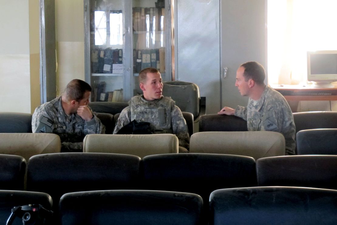 Army Maj. Frank Rosenblatt, right, works to bring charges against a suspected insurgent accused of killing a soldier.