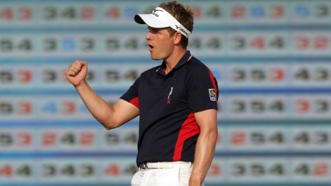 Luke Donald celebrates on the final hole after clinching the Race to Dubai title to make golfing history.