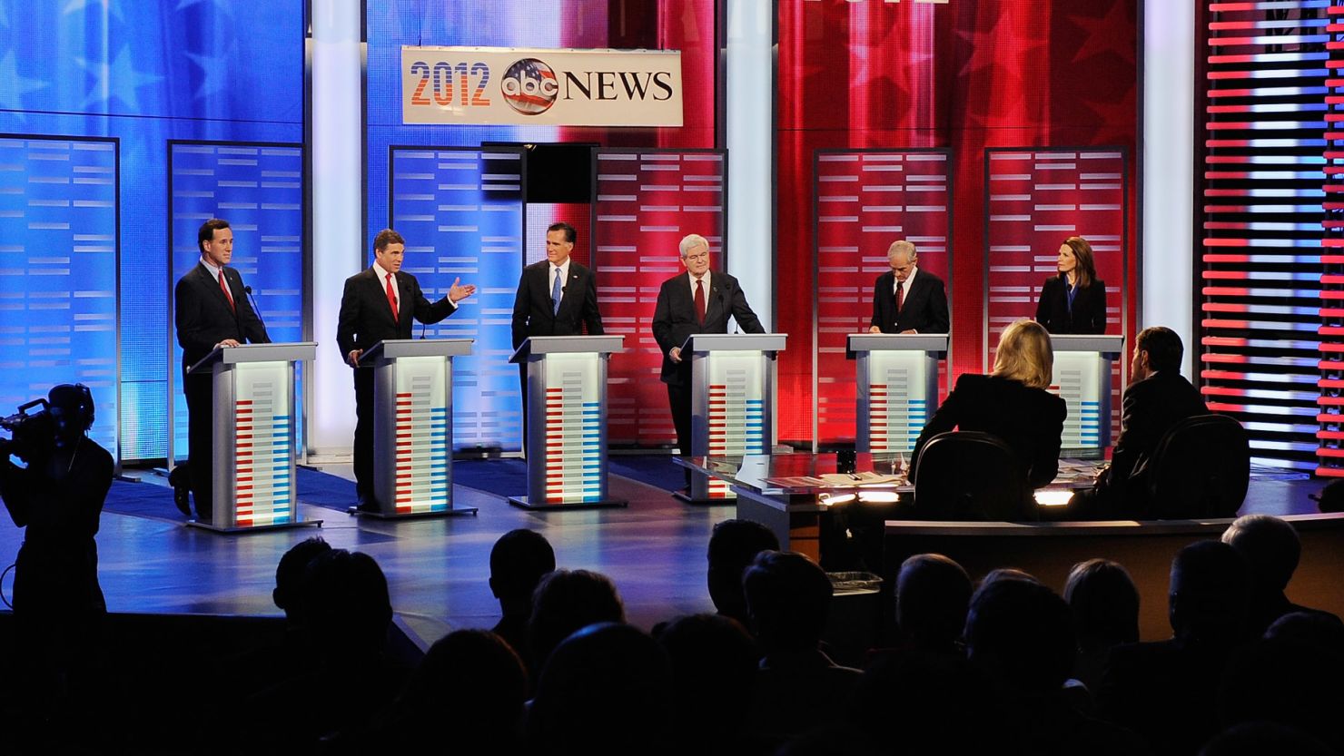Rick Santorum, from left, Rick Perry, Mitt Romney, Newt Gingrich, Ron Paul and Michele Bachmann debate in Iowa on Saturday.