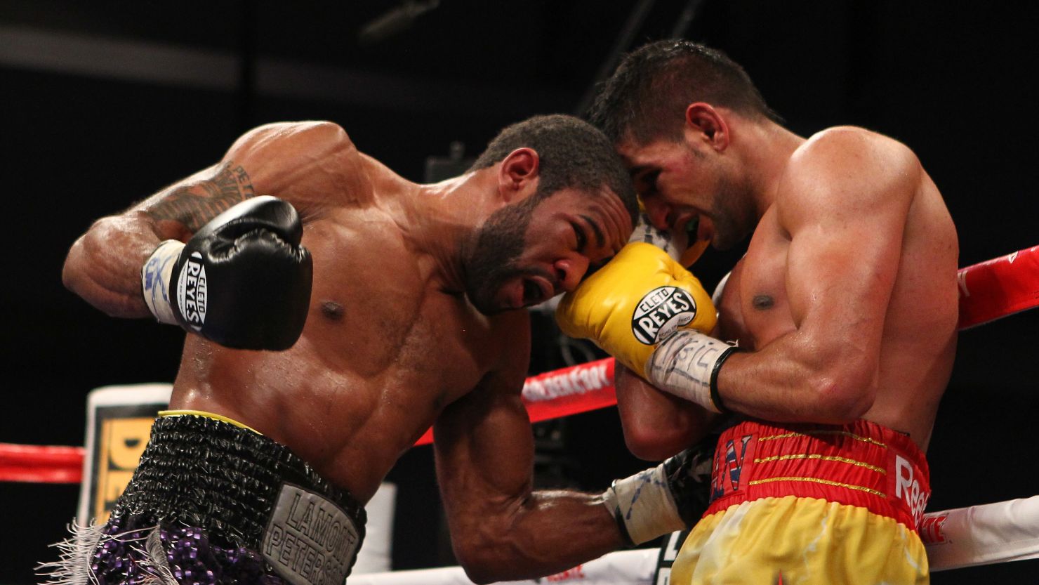 Lamont Peterson (left) goes toe-to-toe with Amir Khan on his way to a controversial points victory.