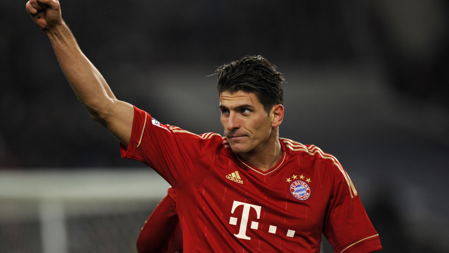 Mario Gomez celebrates his opening goal in Bayern Munich's 2-1 victory at Stuttgart.