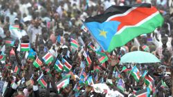 9 July 2011 Thousands of Southern Sudanese wave the flag of their new country during a ceremony in the capital Juba on July 09, 2011 to celebate South Sudan's independence from Sudan.