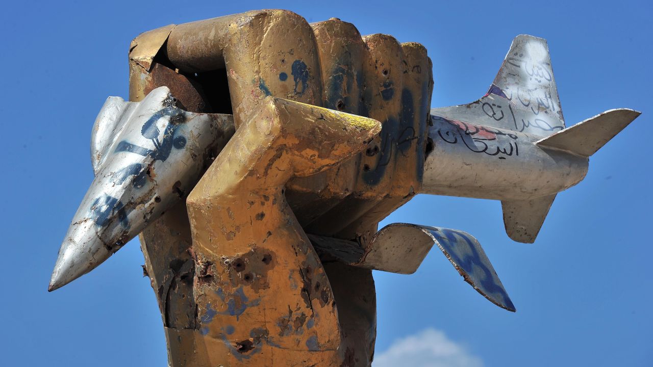 Libyan rebels cut down Moammar Gadhafi's golden fist after seizing his compound in Tripoli.