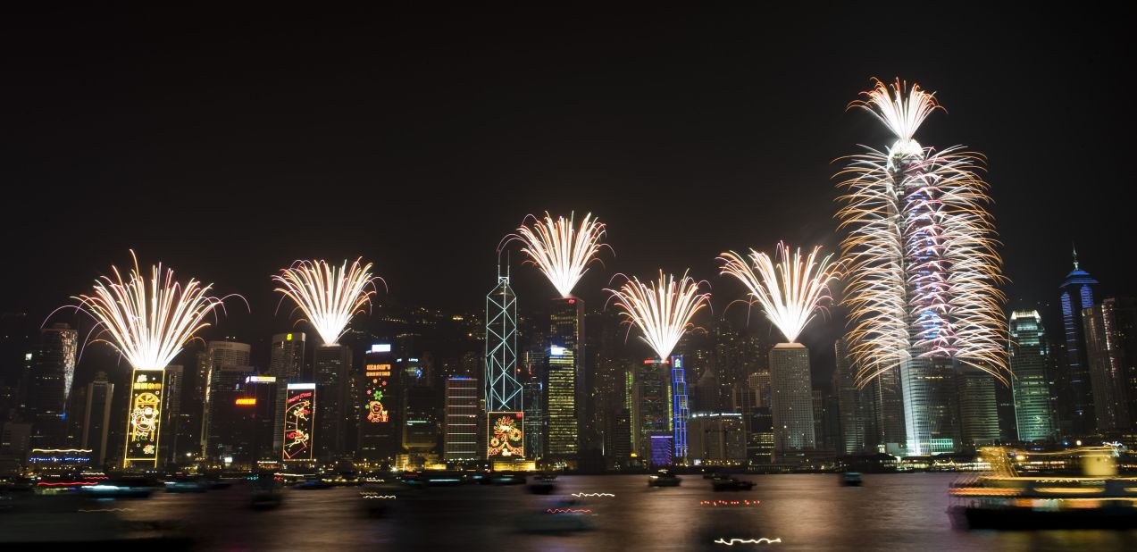 The business district comes to life during New Year's celebration in Hong Kong's Victoria Harbor. 