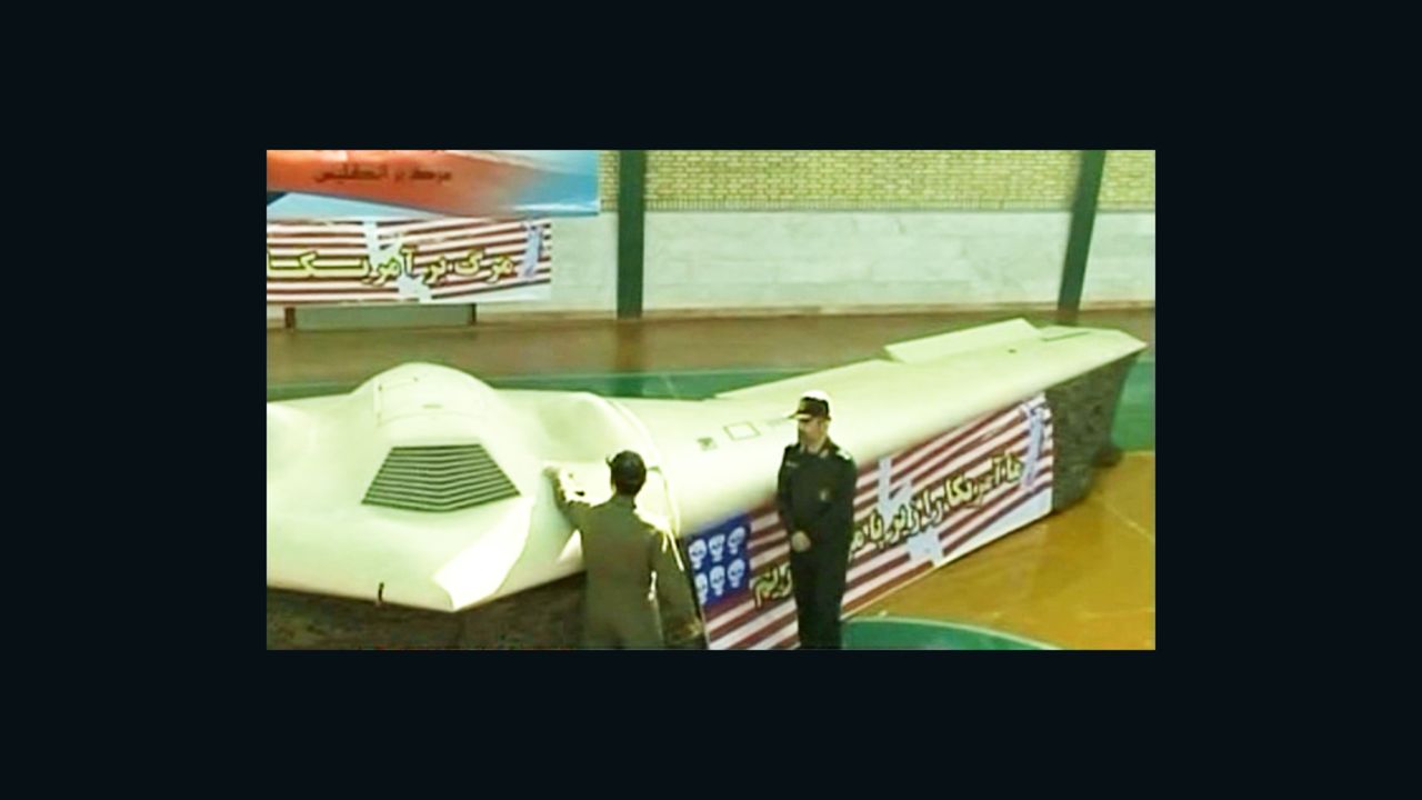 Iranian officials display what they say is an unmanned U.S. spy plane brought down in Iran last week. 