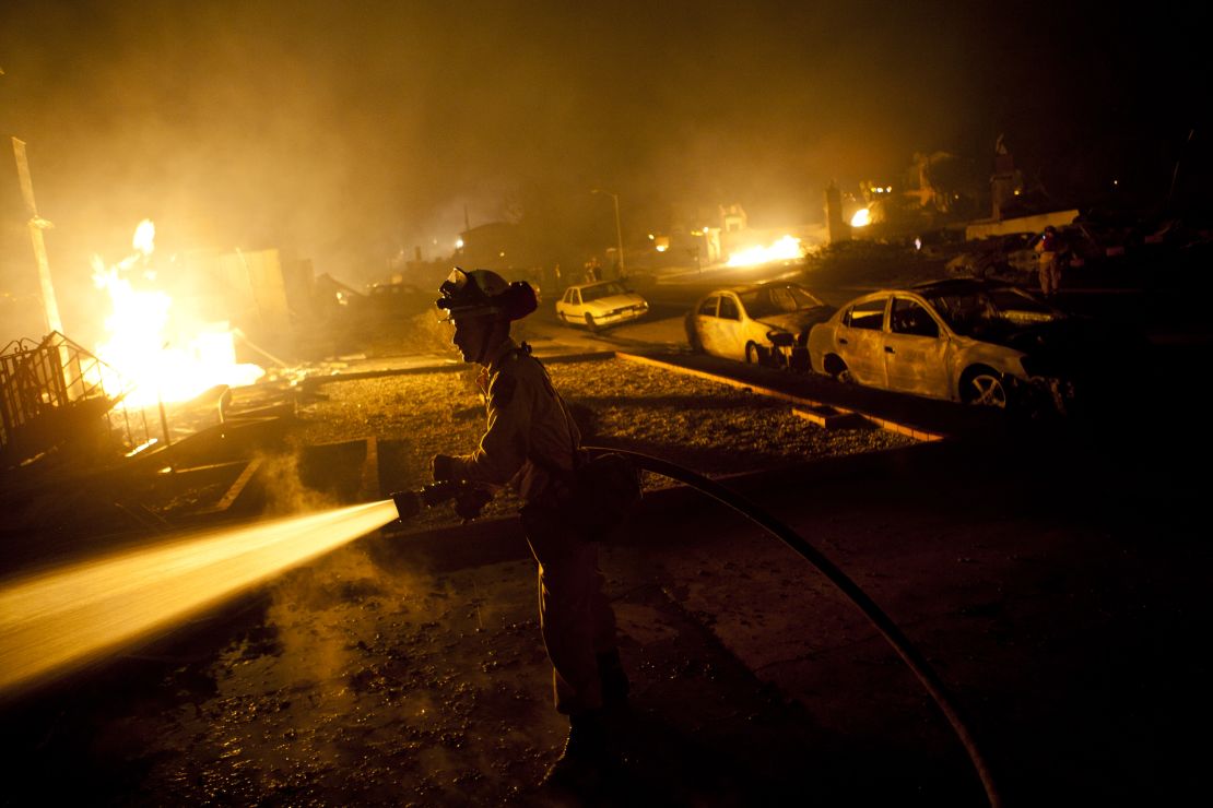 A firefighter works on a gas pipeline blaze September 9, 2010, in San Bruno, California.
