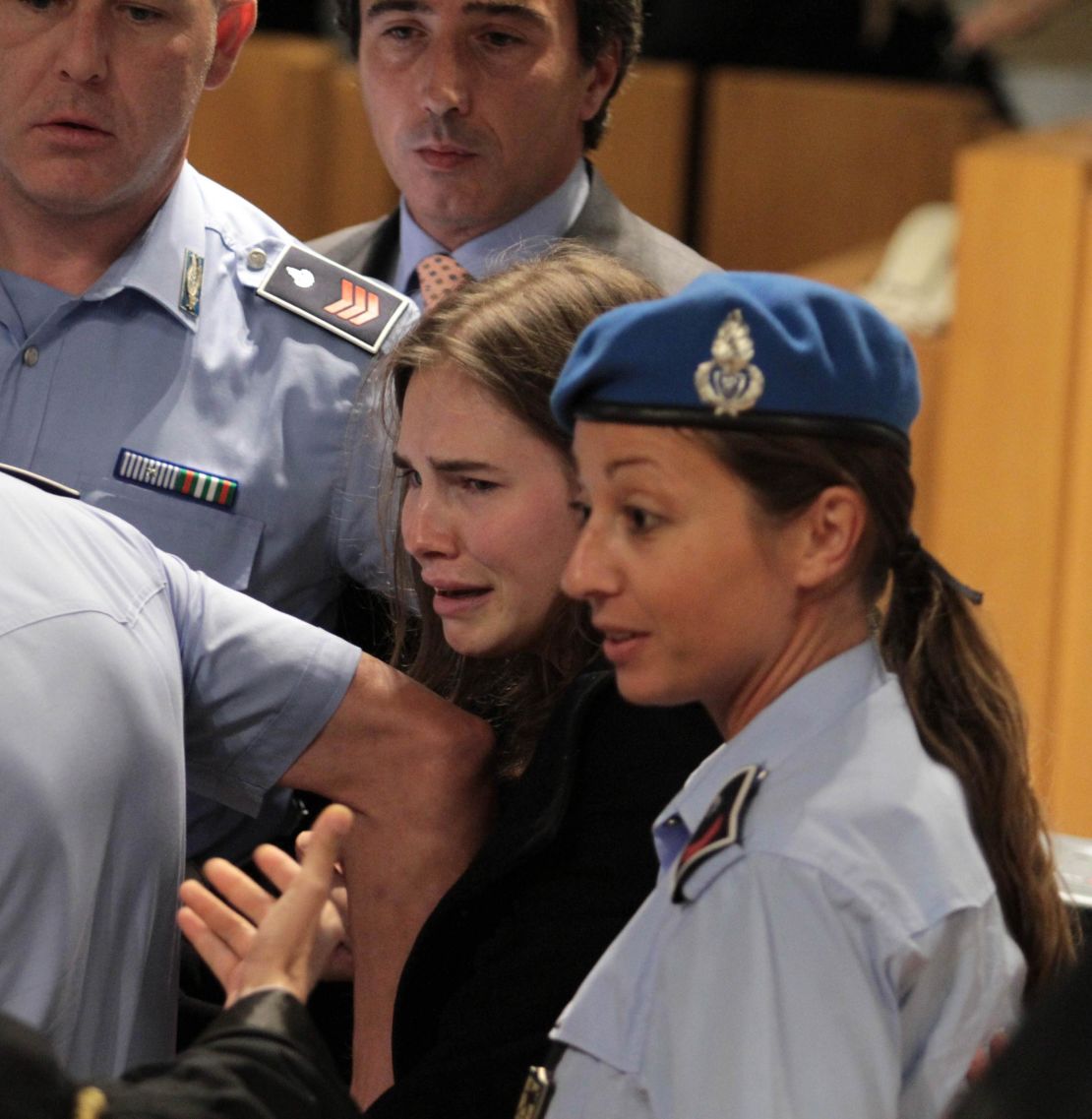 Knox breaks into tears as she leaves the court after being acquitted on October 3, 2011, for Kercher's murder.