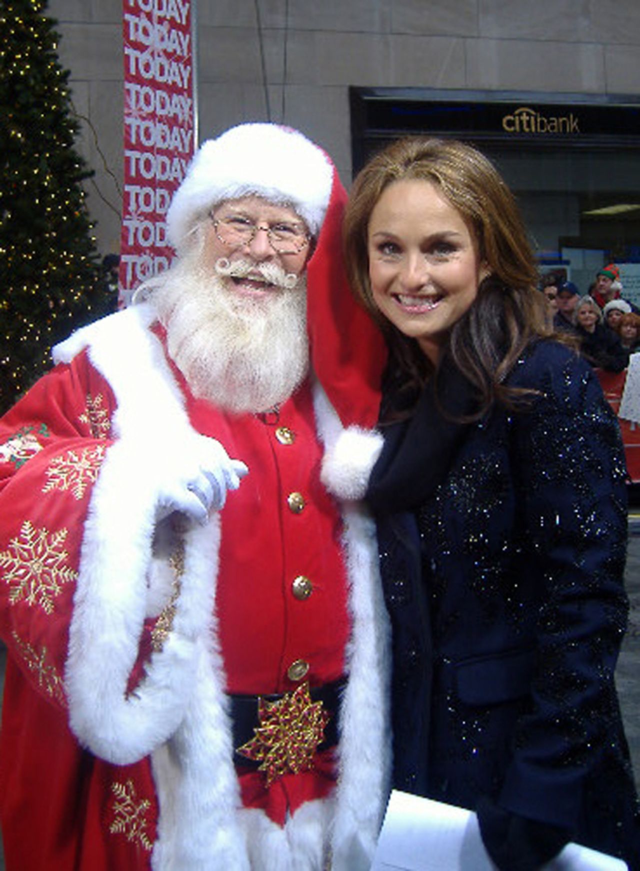 Tim Connaghan, seen here with chef and TV personality Giada De Laurentiis, is in the business of selling Santa. Not only is he out there, he's booking gigs for up to 2,000 others. 