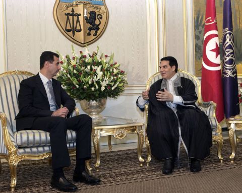 Former Tunisian President Zine El-Abidine Ben Ali (R) talks with Syrian President Bashar al- Al Assad (L) in Tunis on July 12, 2010.  After three weeks of violent protests over rising unemployment rates, poverty levels, inflation and government repression, Ben Ali fleed the country for Saudi Arabia on January 14.