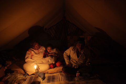 A Somali family sit in a tent at a United Nations displacement camp on March 11, 2011 in Ras Jdir, Tunisia. Tens of thousands of guest workers from Egypt, Tunisia, Bangladesh, Sudan and other countries fled to the Tunisian border to escape fighting in and around the Libyan capital of Tripoli.
