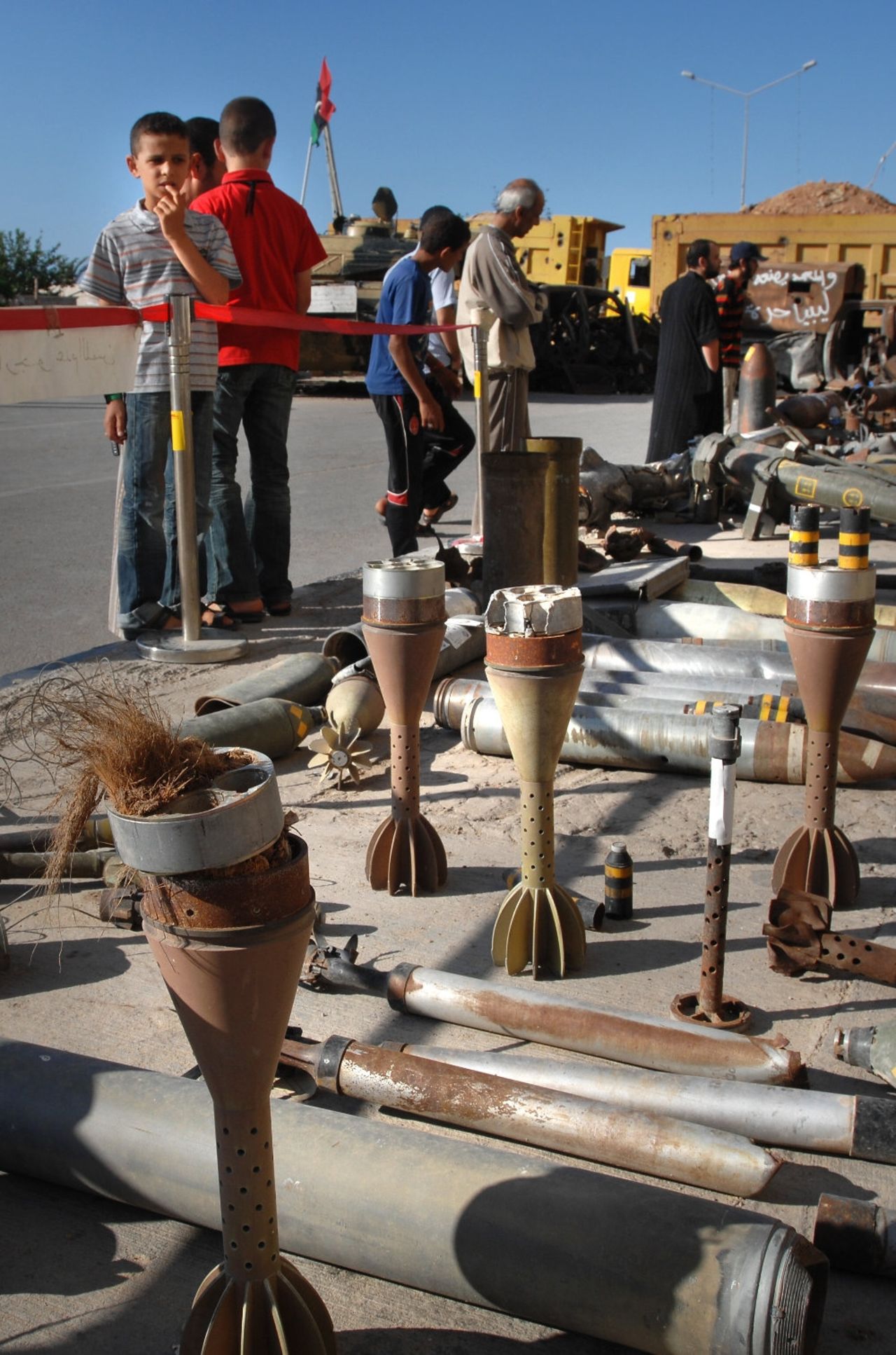 Children visit a makeshift musem in Tripoli Street, Misrata. Mines Advisory Groups warns that these museums, including live cluster munitions, rockets and shells, are a particular hazard.     