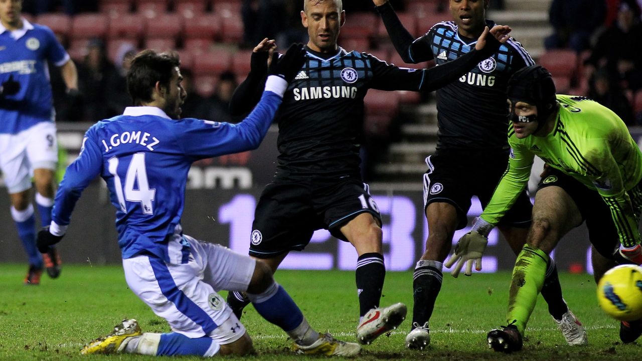 Jordi Gomez scores Wigan's equalizer against Chelsea at the DW Stadium on Saturday.