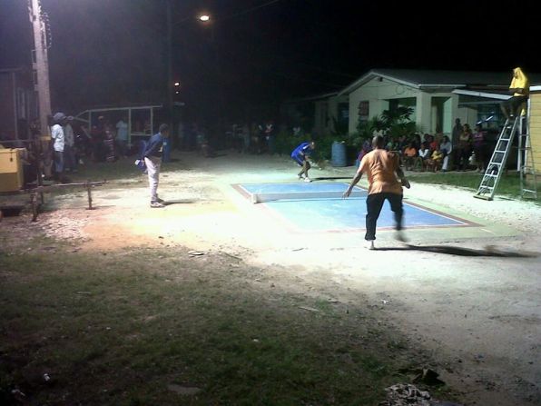 Improvised floodlights are used to make sure road tennis can be played in any setting and at any time in Barbados.