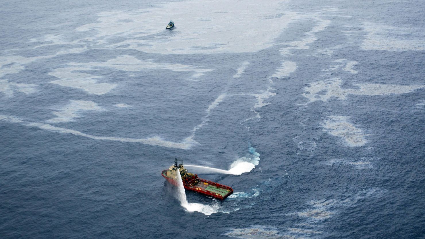 Boats work to disperse an oil spill northeast of Rio de Janeiro in November.