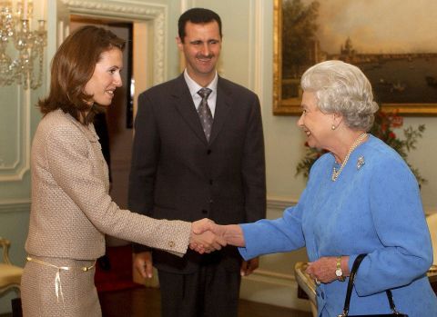 Asma Al-Assad meets Queen Elizabeth at Buckingham Palace in London in December 2002.