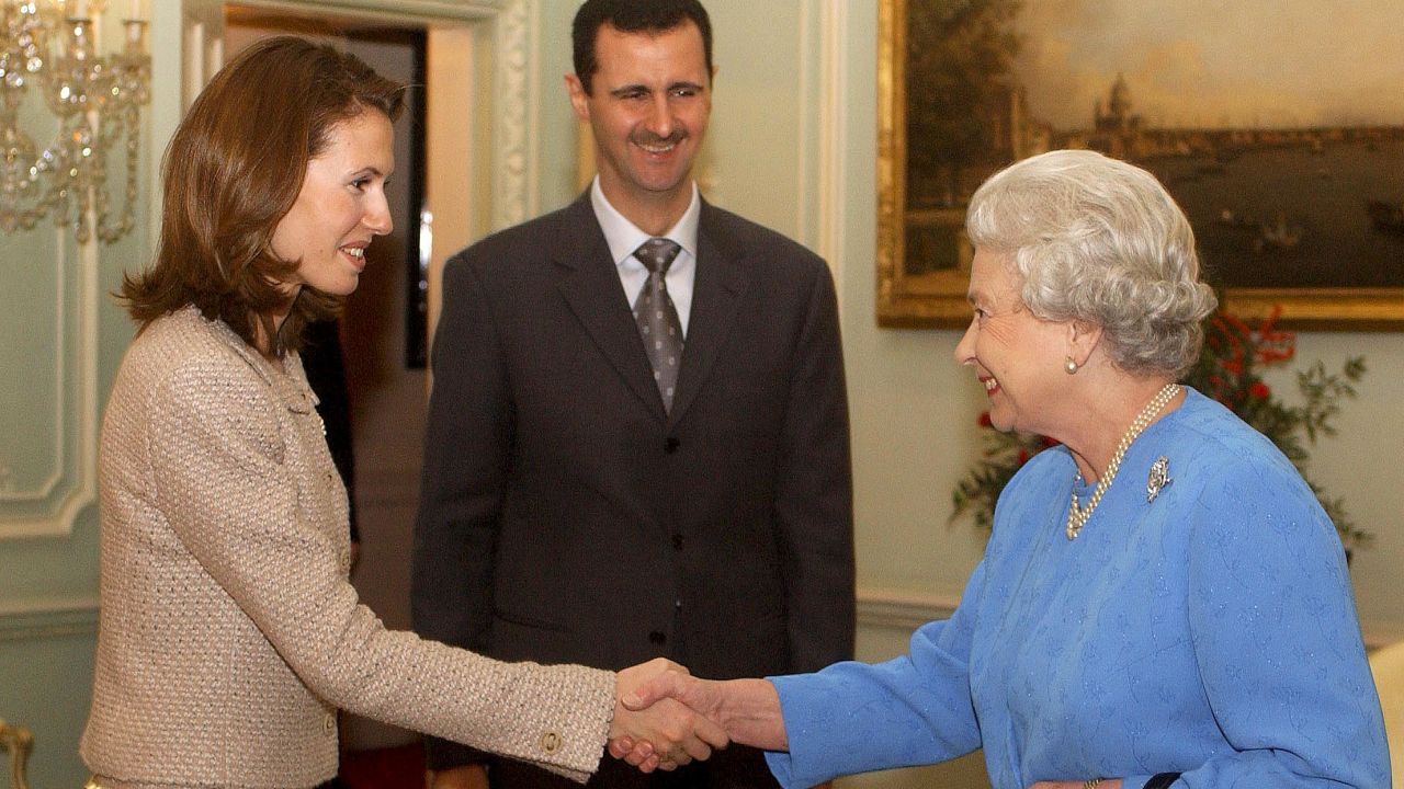 President Bashar al-Assad and his wife Asma meet Queen Elizabeth II at Buckingham Palace in December 2002.