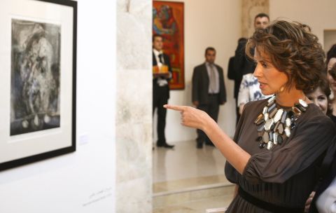 Asma al-Assad attends the opening of the Syrian abstract art exhibition in Damascus on July 21, 2008.