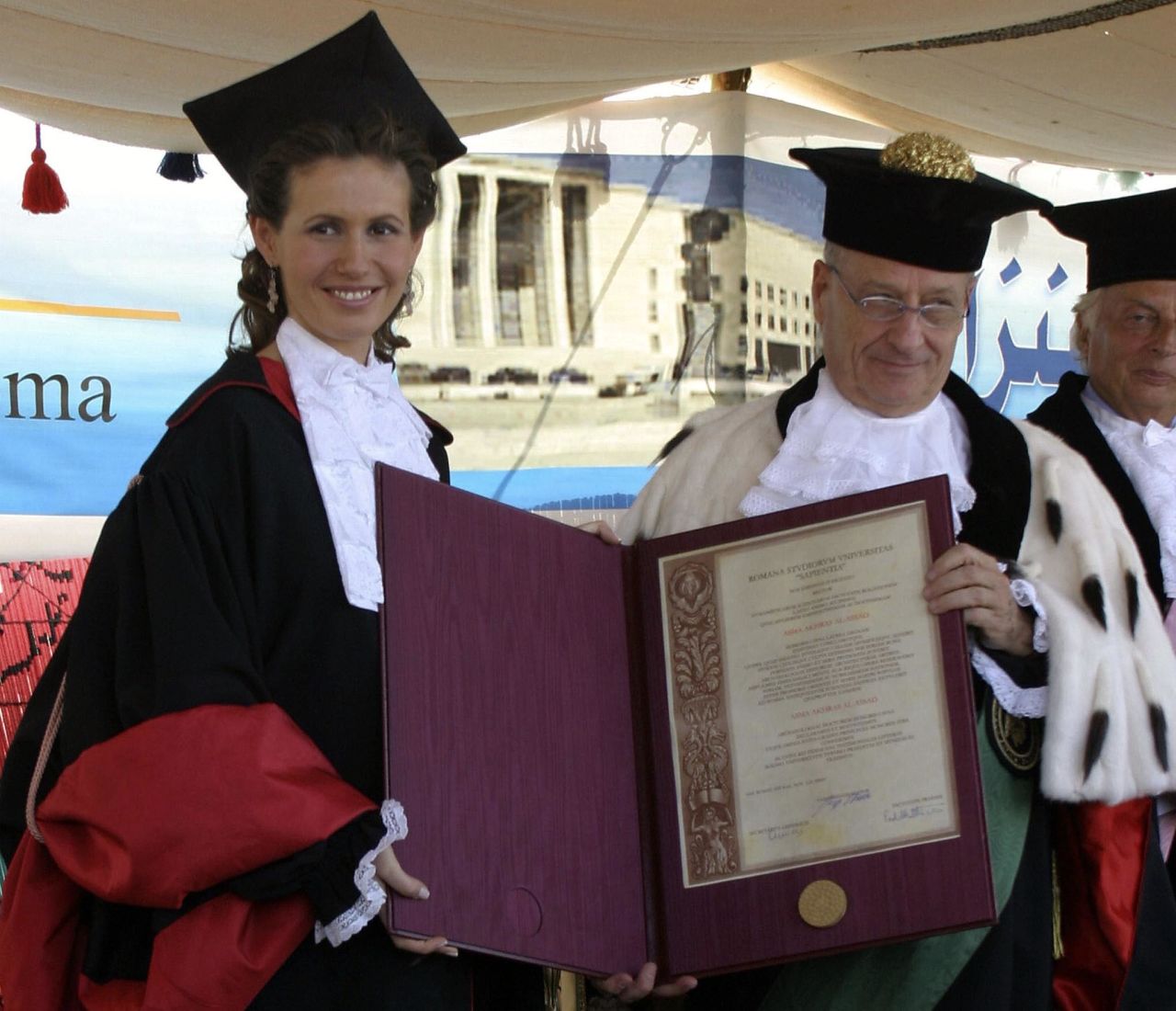 Asma al-Assad gets an honorary doctorate from Roberto Antonelli, the president of Rome's La Sapienza University, October 20, 2004, in the Syrian city of Ebla.