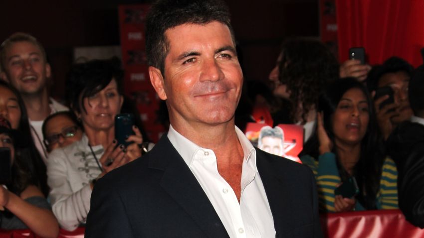 Simon Cowell arrives to the "X Factor" premiere in Hollywood, California on September 14, 2011