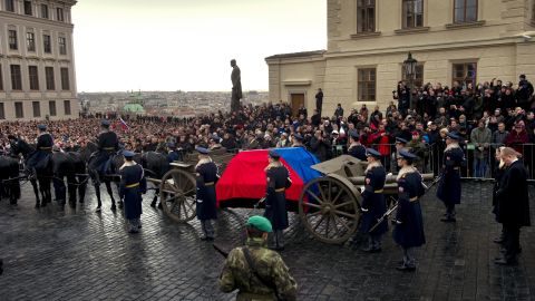 Crowds watch as the coffin of former President Vaclav Havel is brought to Prague Castle ahead of his state funeral.