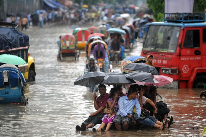 Bangladeshis attempt to stay dry above flood waters in the capital, Dhaka. Bangladesh was ranked by Maplecroft the country most vulnerable to climate change, and Dhaka the world's most vulnerable city, due to its exposure to threats such as flooding, storm surge, cyclones and landslides, its susceptible population and weak institutional capacity to address the problem.