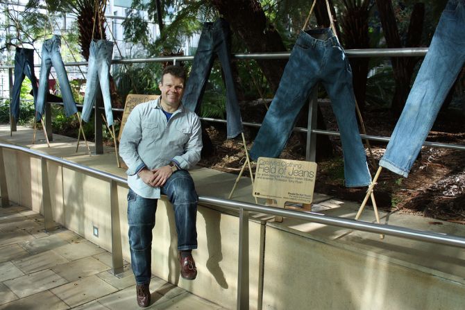 A catalyst -- titanium dioxide -- applied during a normal home washing cycle breaks down harmful airborne pollutants when exposed to ultraviolet light. Ryan discovered that treated jeans were particularly good at absorbing pollution.