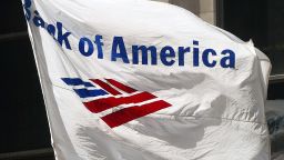 CHICAGO - APRIL 6: A Bank of America flag flies outside its building April 6, 2004 in Chicago. Charlotte, North Carolina-based Bank of America has said it will cut 12,500 jobs after its recent merger with FleetBoston Financial Corp. (Photo by Tim Boyle/Getty Images)