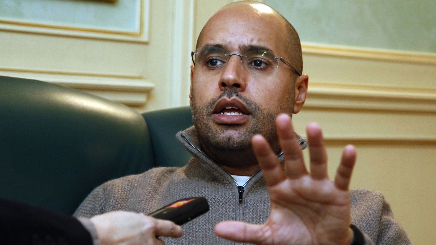 Saif al-Islam Gadhafi speaks during a press interview in Tripoli on February 26, 2011 