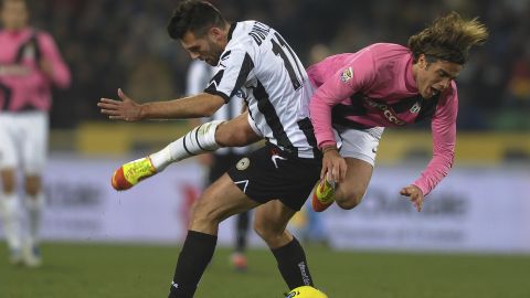Alessandro Matri of Juventus, left, tussles with Udinese's Maurizio Domizzi during Wednesday's draw at Stadio Friuli.