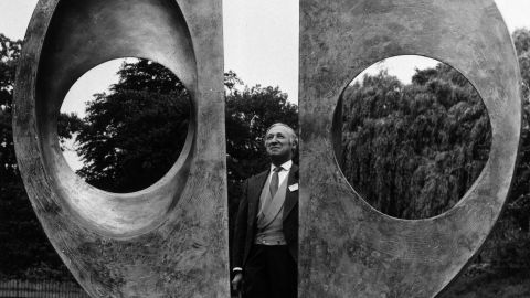 Arts official Harold Sebag-Montefiore inspects Barbara Hepworth's "Two Forms (Divided Circle)" on its installation in Dulwich Park in 1970.
