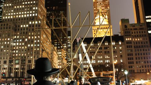 New Yorkers light a massive menorah in Manhattan on Tuesday to mark the beginning of Hanukkah.