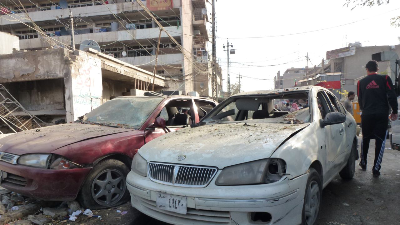 Car windows shattered during a wave of bombings in in Baghdad that killed more than 60 people.