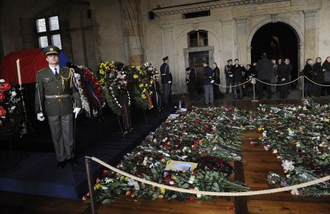 Soldiers stand next to Havel's flag-draped coffin, ahead of his funeral