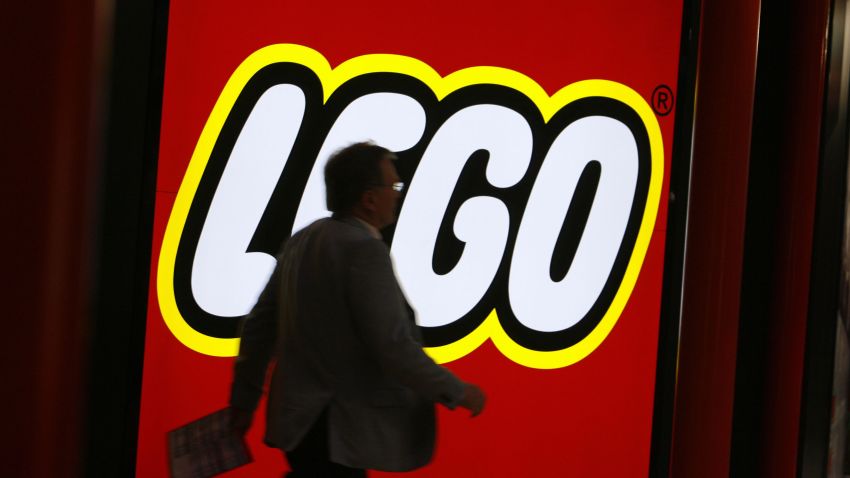 A fair-goer walks past the logo of Danish toy maker Lego 01 February 2007 at the International Toy Fair in Nuremberg, southern Germany
