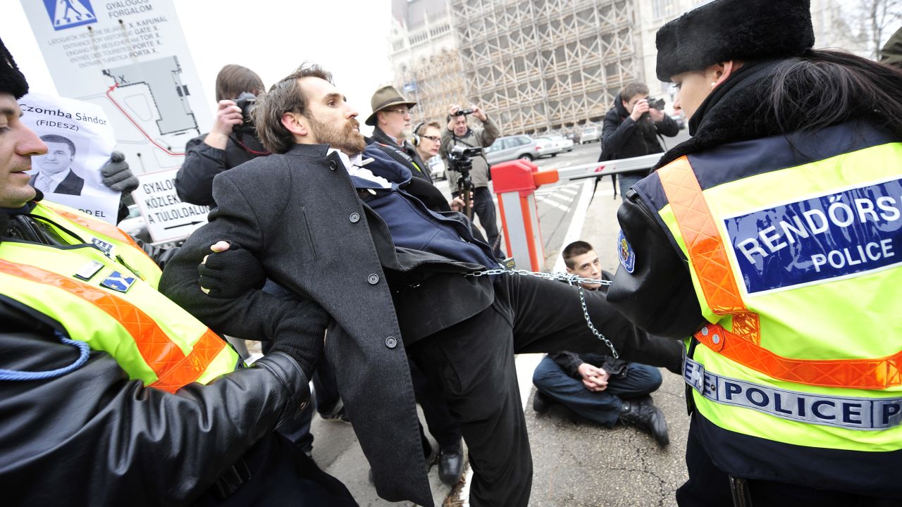Opponents of Viktor Orban's government were arrested for blocking entrances and exits from the Hungarian parliament building.