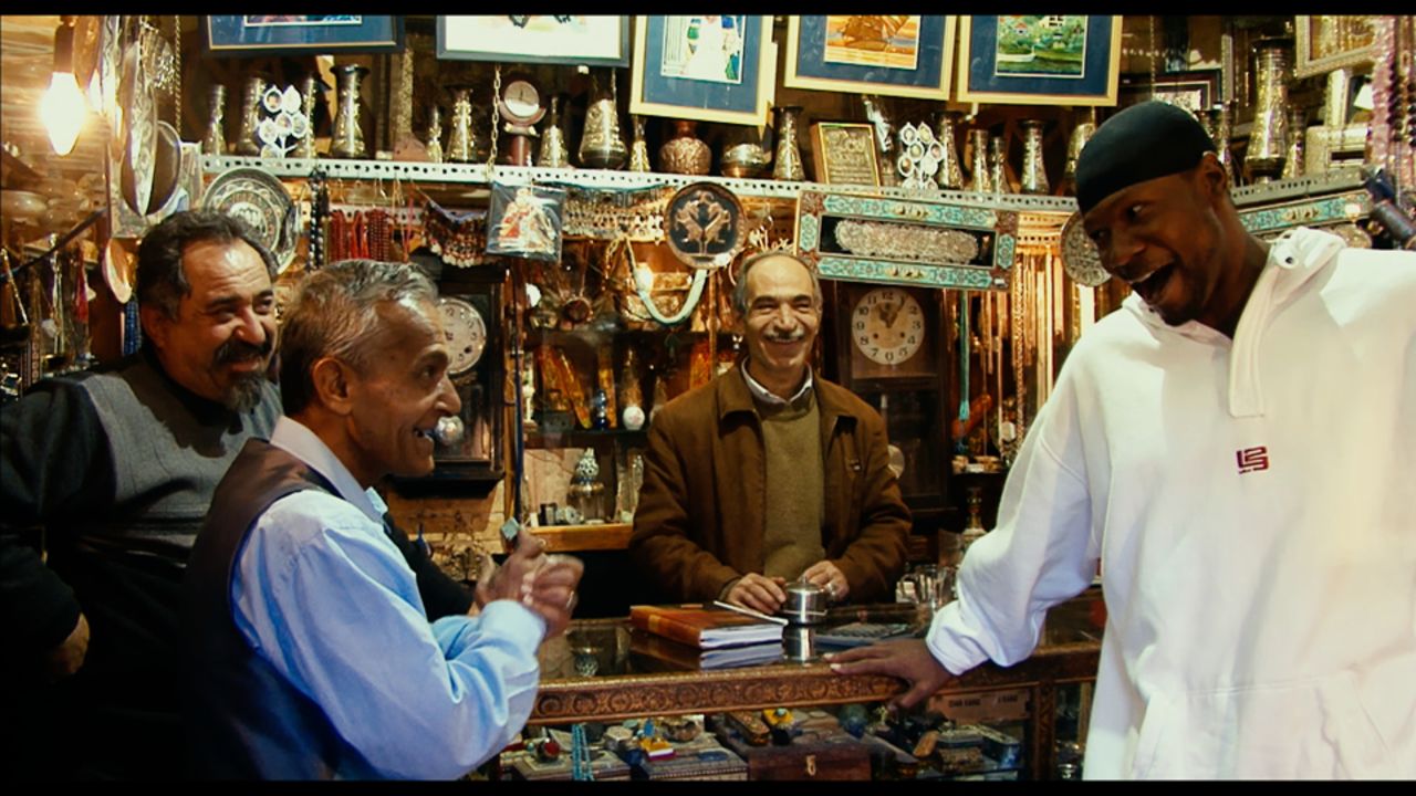 Sheppard tries his hand at bartering at a bazaar in the Iranian capital of Tehran.