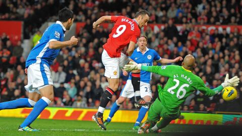 Dimitar Berbatov scores the second of his hat-trick as Manchester United thrashed Wigan 5-0.
