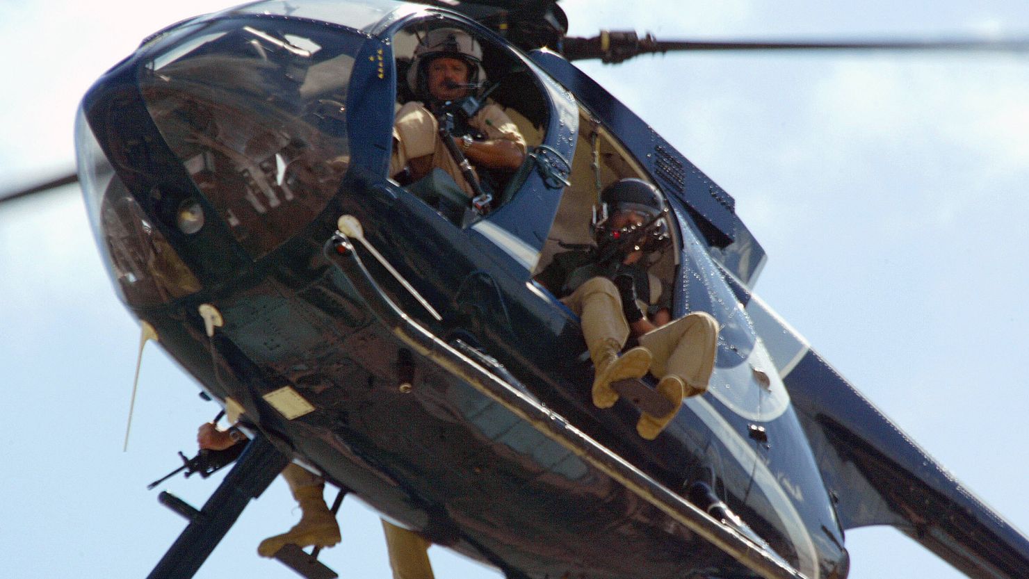 Members of Blackwater, a private U.S. security company, patrol over Baghdad in April 2004.